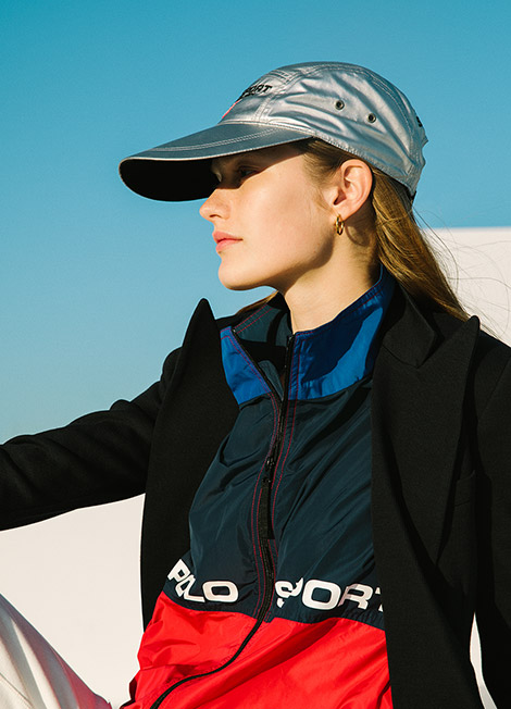 Woman in metallic cap & color-blocked Polo Sport jacket
