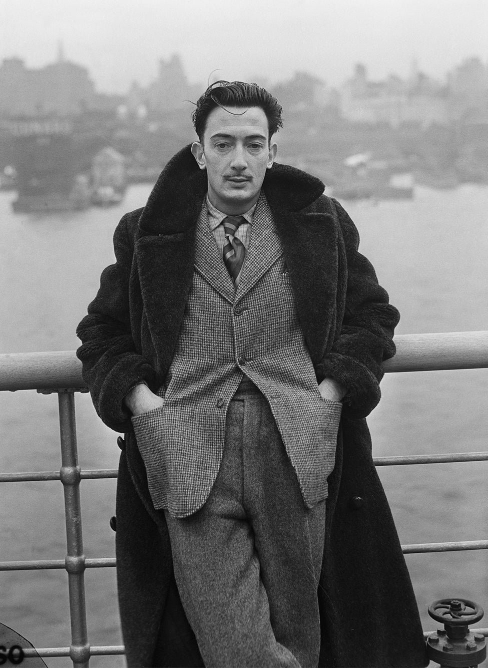 Salvador Dal&iacute; in a statement coat on the deck of the <em>S.S. Normandie</em>