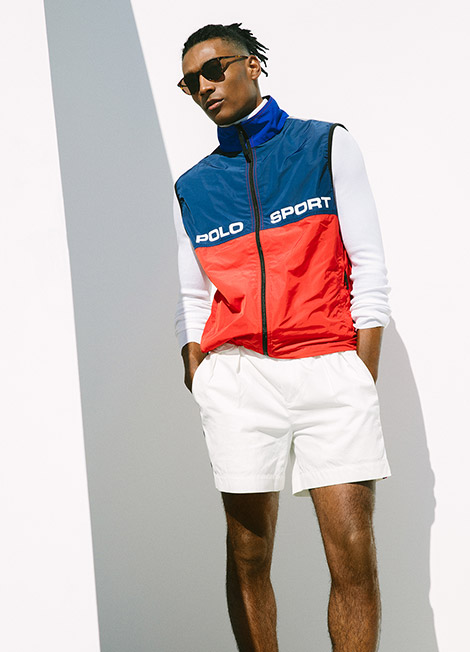 Man in color-blocked blue and red performance vest