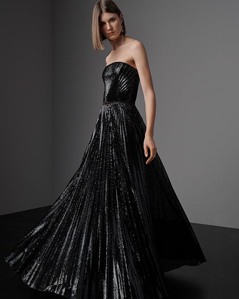 Woman in black sequined gown