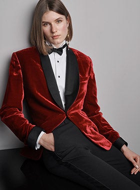 Woman in red velvet tuxedo jacket